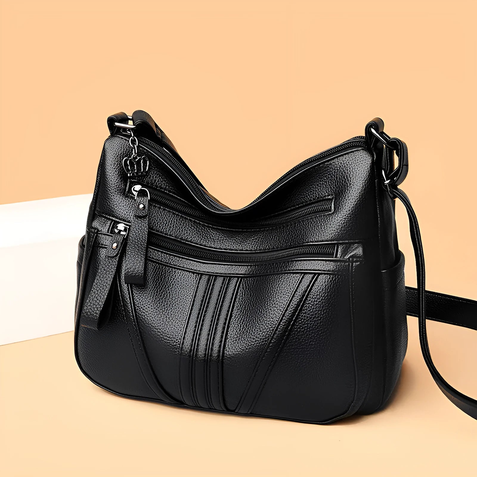 Genuine leather horizontal square messenger bag with contrasting stitching and single shoulder strap in black