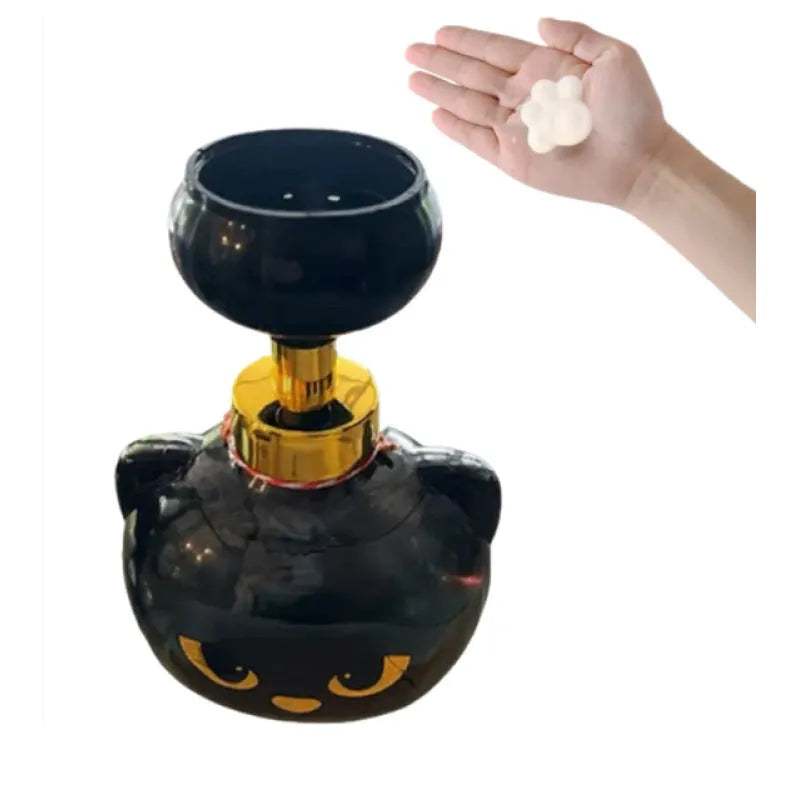 Black cartoon cat-shaped plastic soap dispenser pump bottle on a counter.