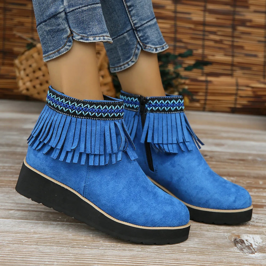Women's suede wedge booties with side zipper, thick rubber sole, and tassel detail in black colour