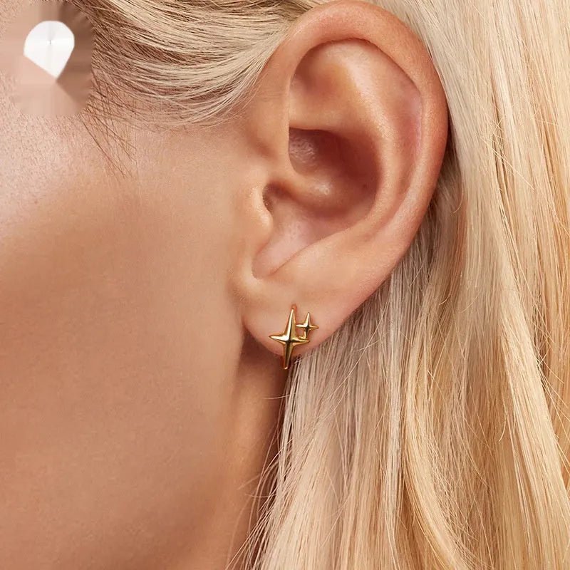 Minimalist star design sterling silver clip earrings with oxidised detailing