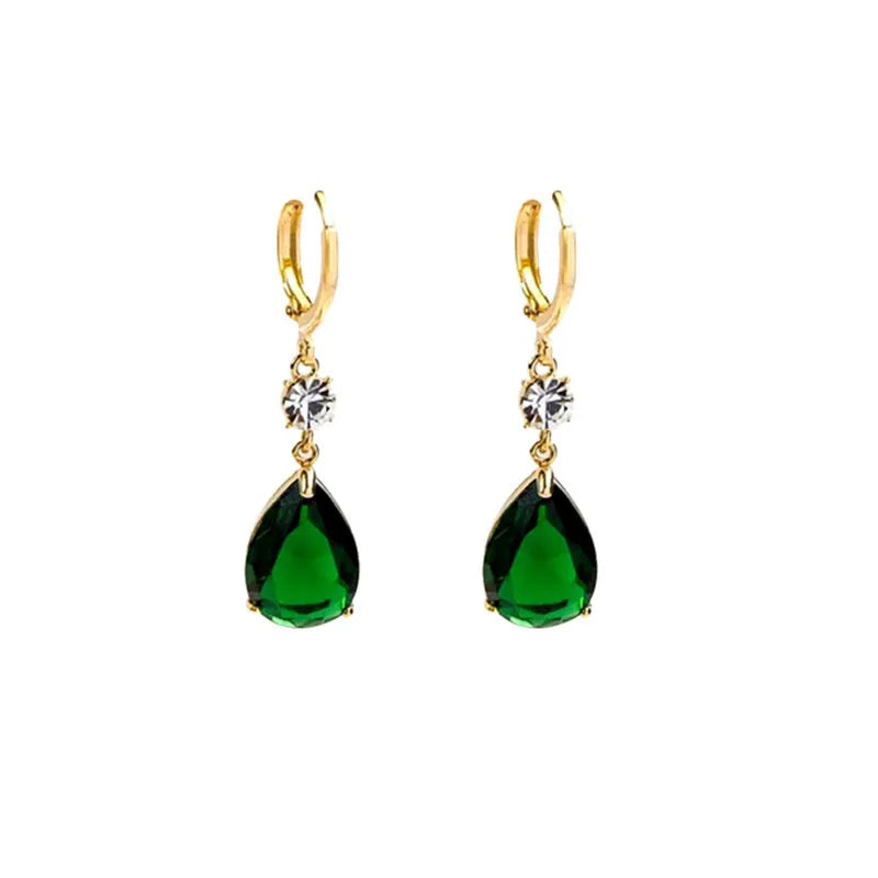 Green geometric teardrop alloy earrings with post findings on plain background