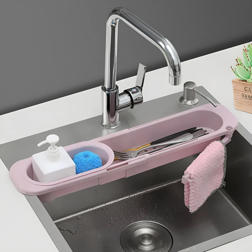Telescopic sink rack in blue grey with sponge and soap on drainer, bar towel holder attached, stable PP construction