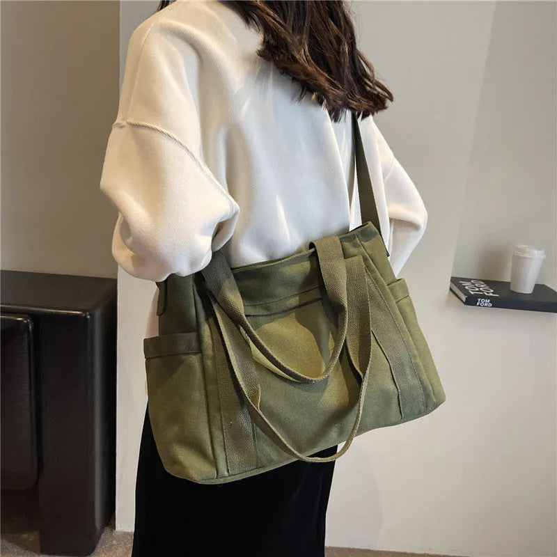 Large capacity shoulder canvas tote bag in solid colour with external sandwich pocket