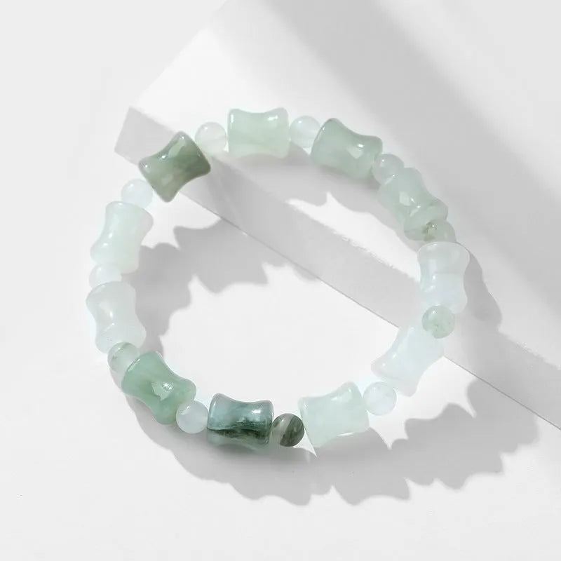 Tianshan Emerald natural chalcedony beaded bracelet with diamond jade centre and coconut shell beads on a white background