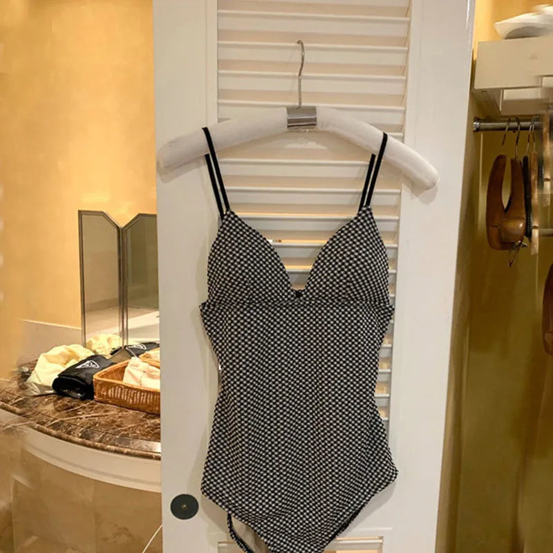 Blue one-piece swimsuit with cover belly design on mannequin