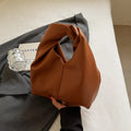 Idle Style Casual Cloud handbag in khaki showing front folding and stitching detail with sandwich pocket