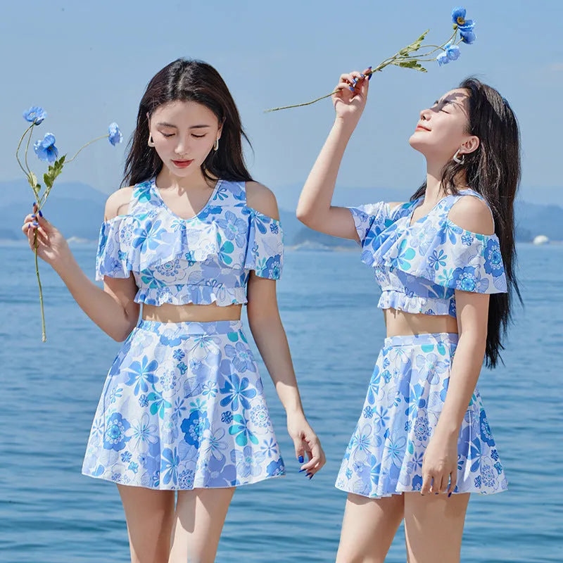 Women's one-piece swimsuit with fresh blue floral print on polyester fabric for summer swimming