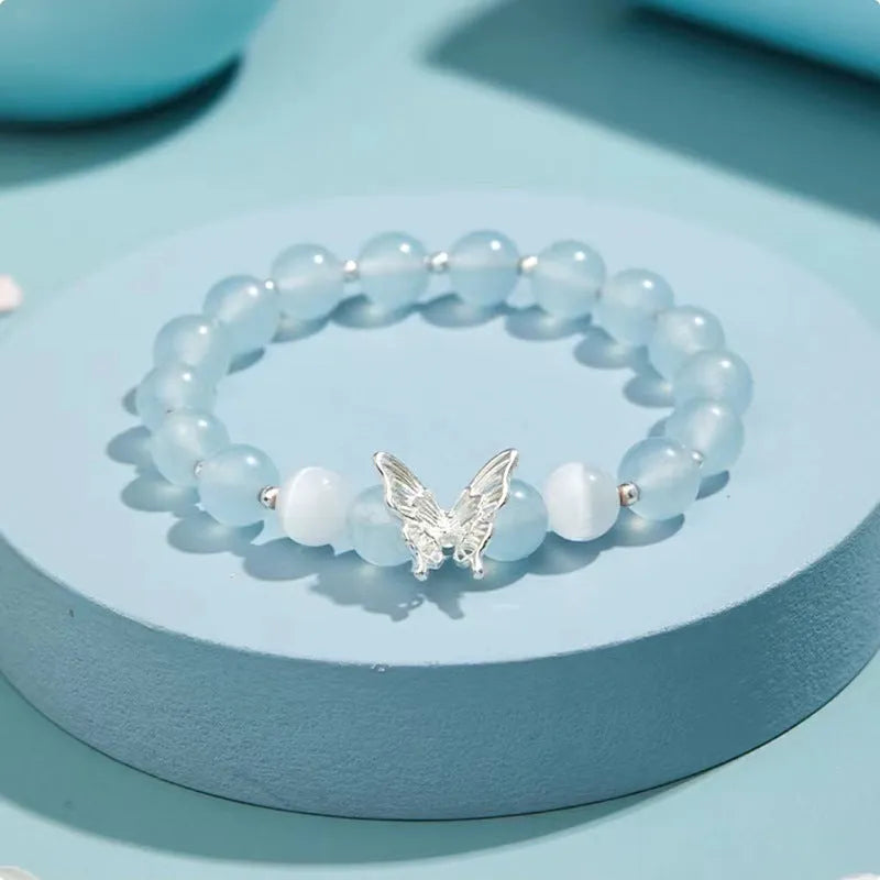 Cat eye crystal bracelet for women, bow shape, pink crystal option, on white background