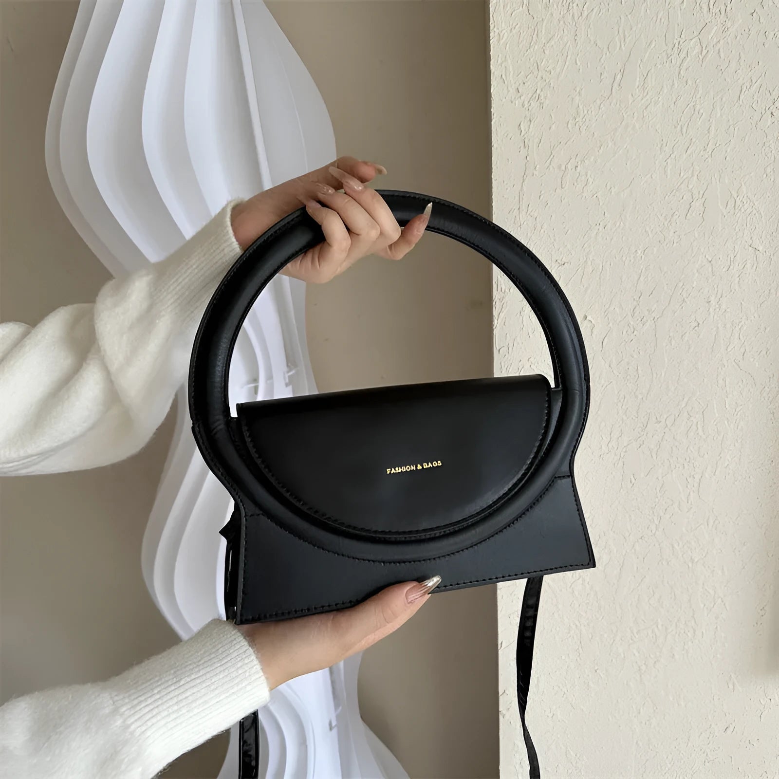 PU leather messenger bag in horizontal square shape with phone pocket and stitching details