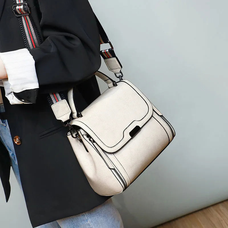 Women's genuine leather messenger bag in horizontal square shape with oil wax finish and multiple internal compartments