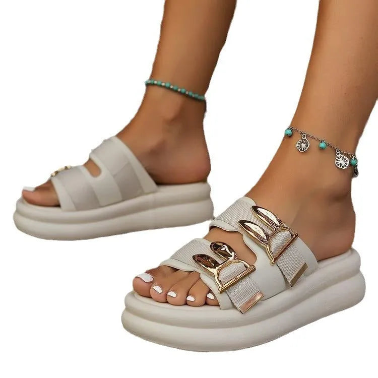 Women's apricot suede slippers with a thick light-coloured rubber sole, shown from the side.