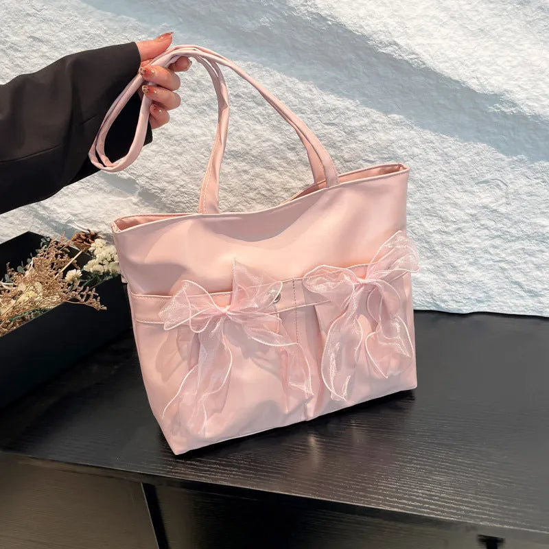 College style bow tote bag in black with large capacity, double shoulder straps, and zipper closure
