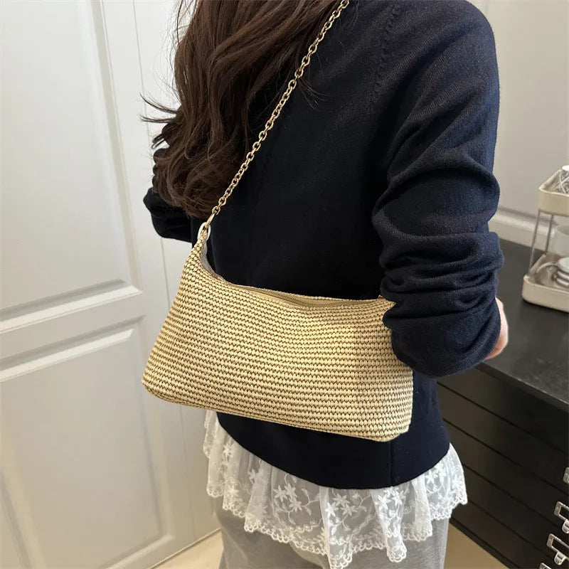 Vacation style straw woven beach shoulder tote bag in horizontal square shape with sandwich pocket