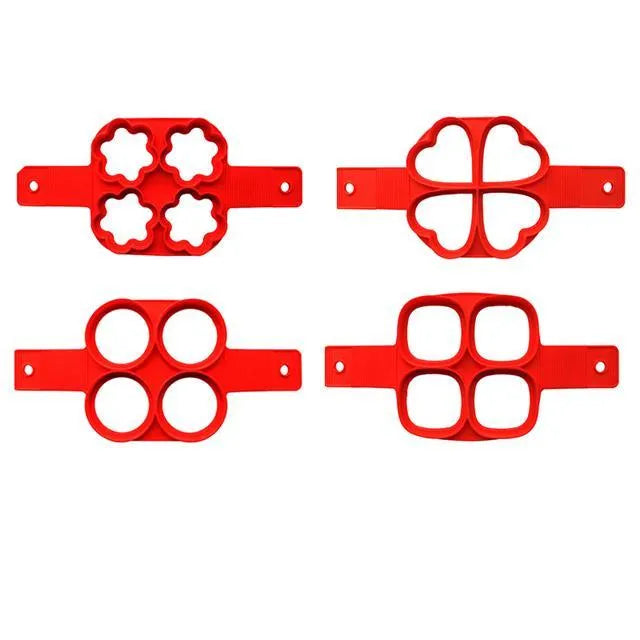 Red silicone nonstick pancake egg ring maker on a cooking surface with a round egg inside