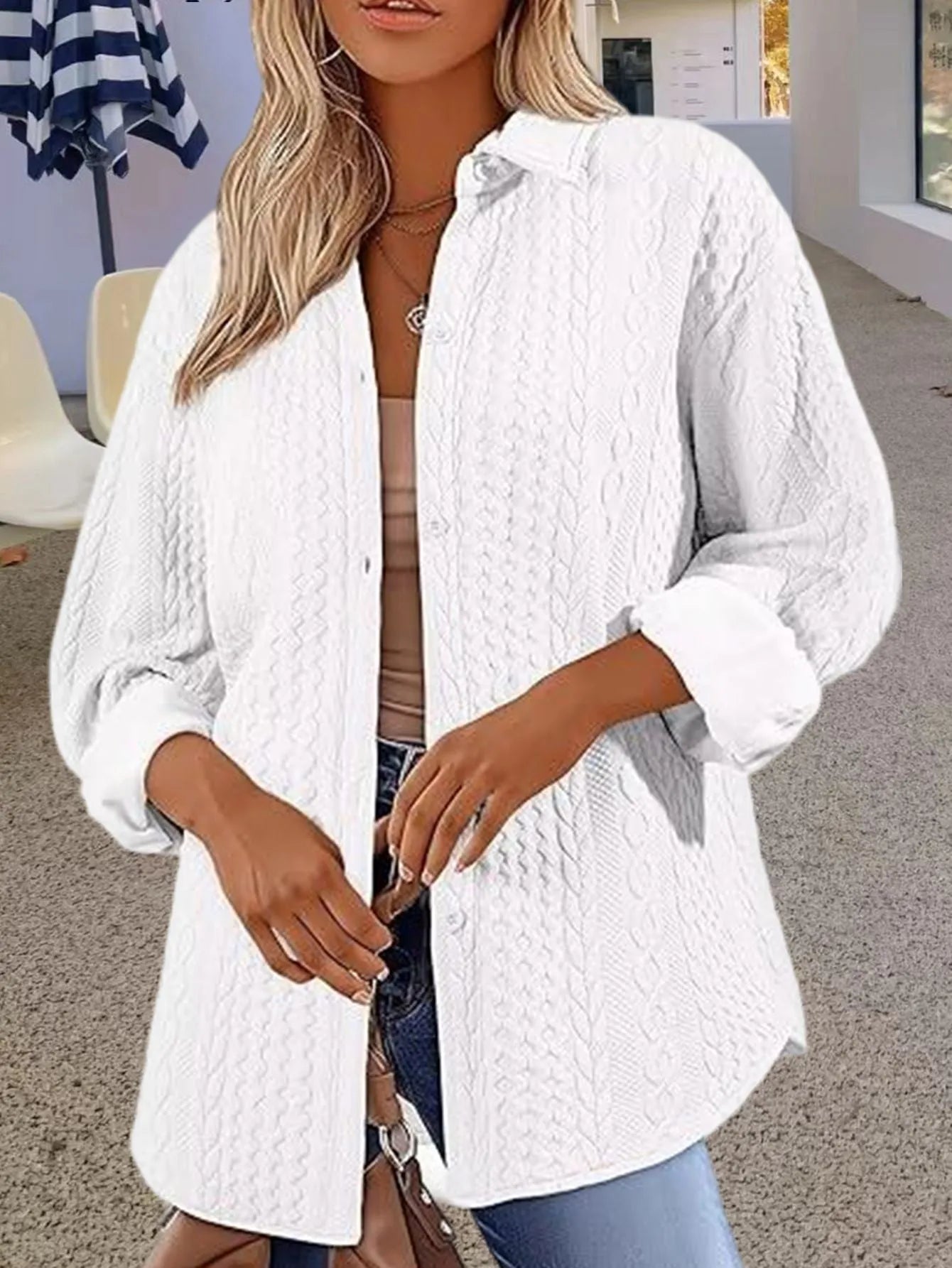Women's solid colour long sleeve knitted cardigan sweater on a hanger
