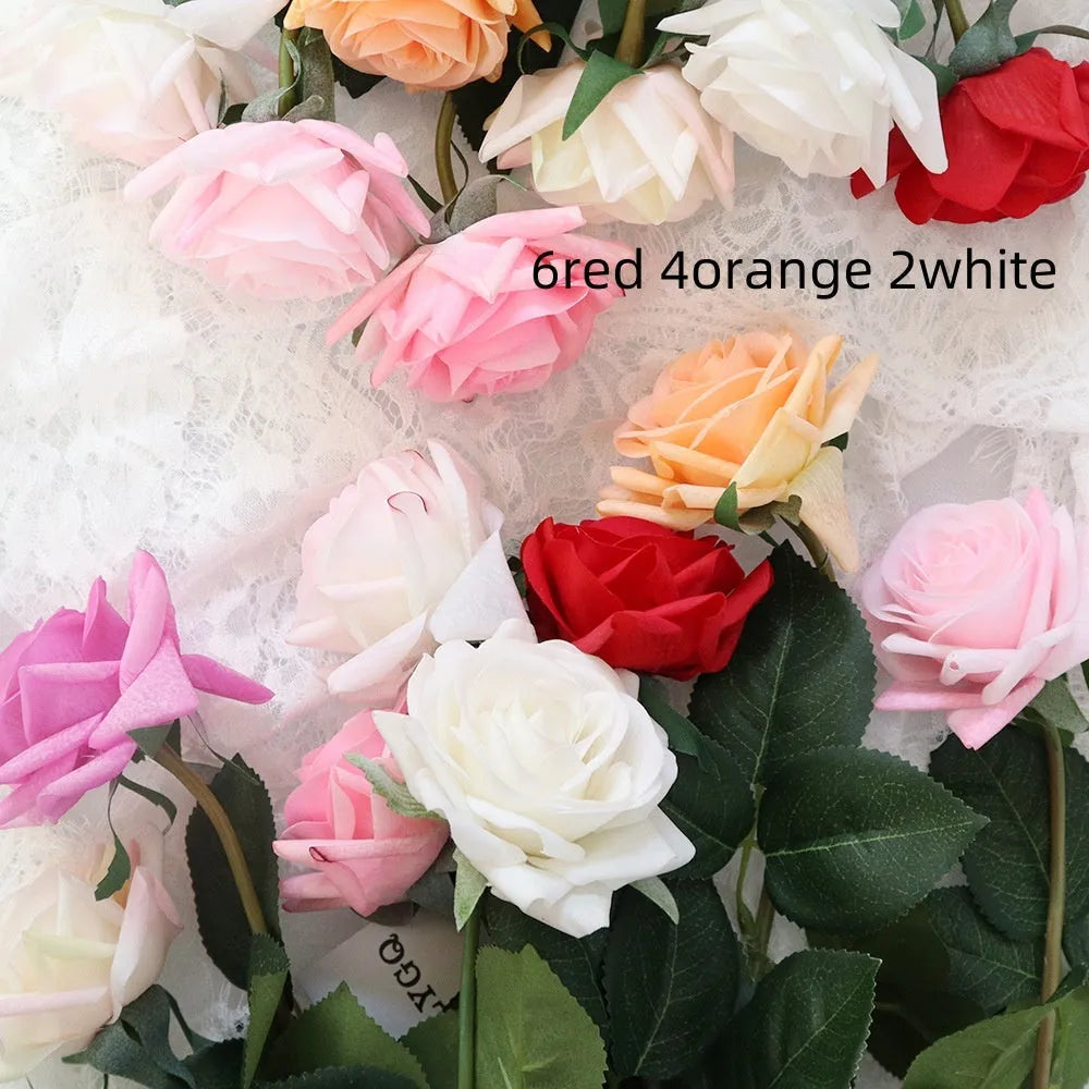 Artificial silk flower bouquet with red petals and green leaves measuring 42cm long