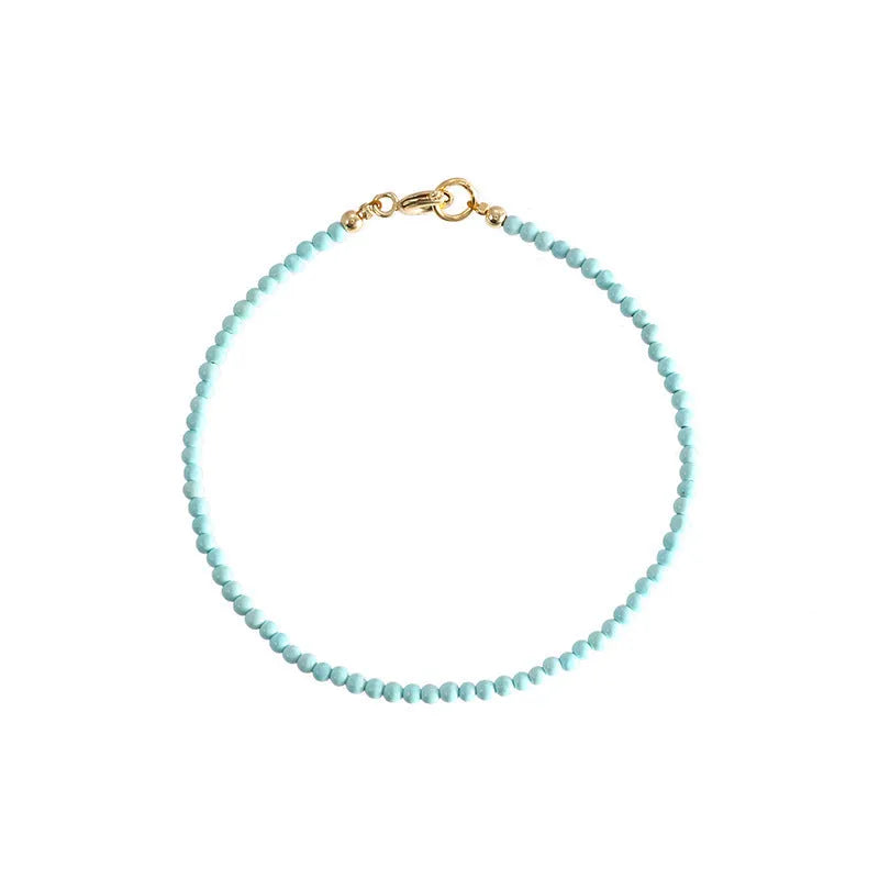 Women's natural turquoise bracelet 2mm beads unisex Chinese style raw ore finish on white background