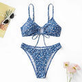 Blue three-piece women's swimsuit set with separate top and shorts on a mannequin.