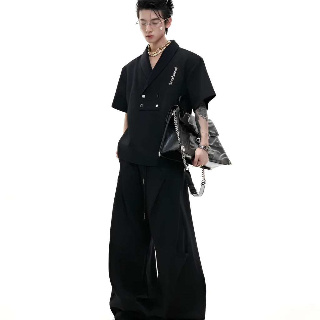 Men's dark grey V-neck padded shoulder short sleeve cotton jacket with metal details and matching trousers.