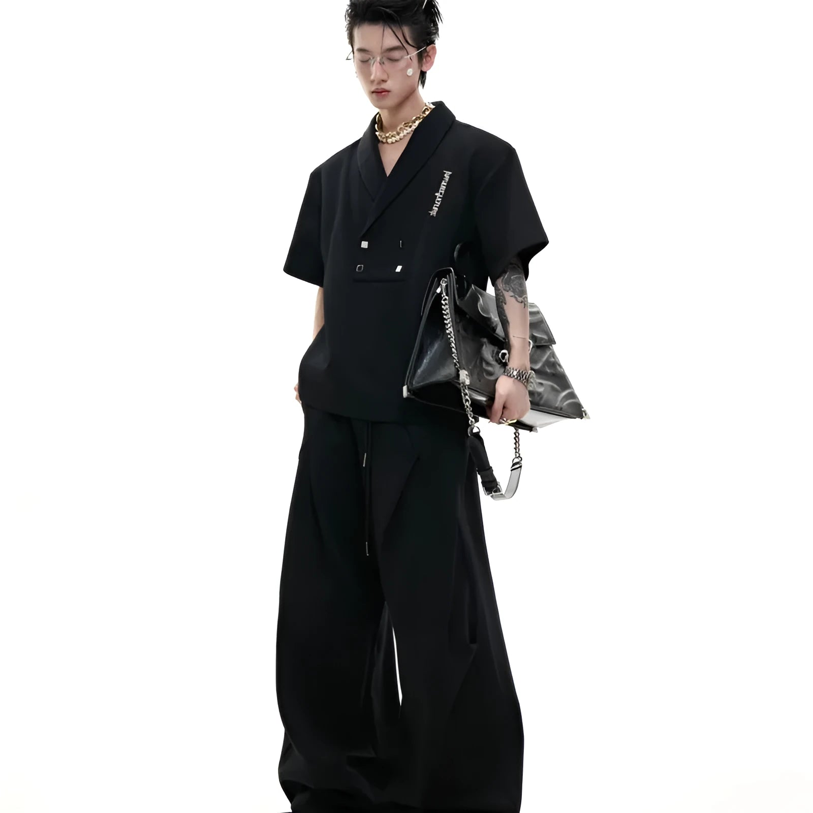 Men's dark grey V-neck padded shoulder short sleeve cotton jacket with metal details and matching trousers.