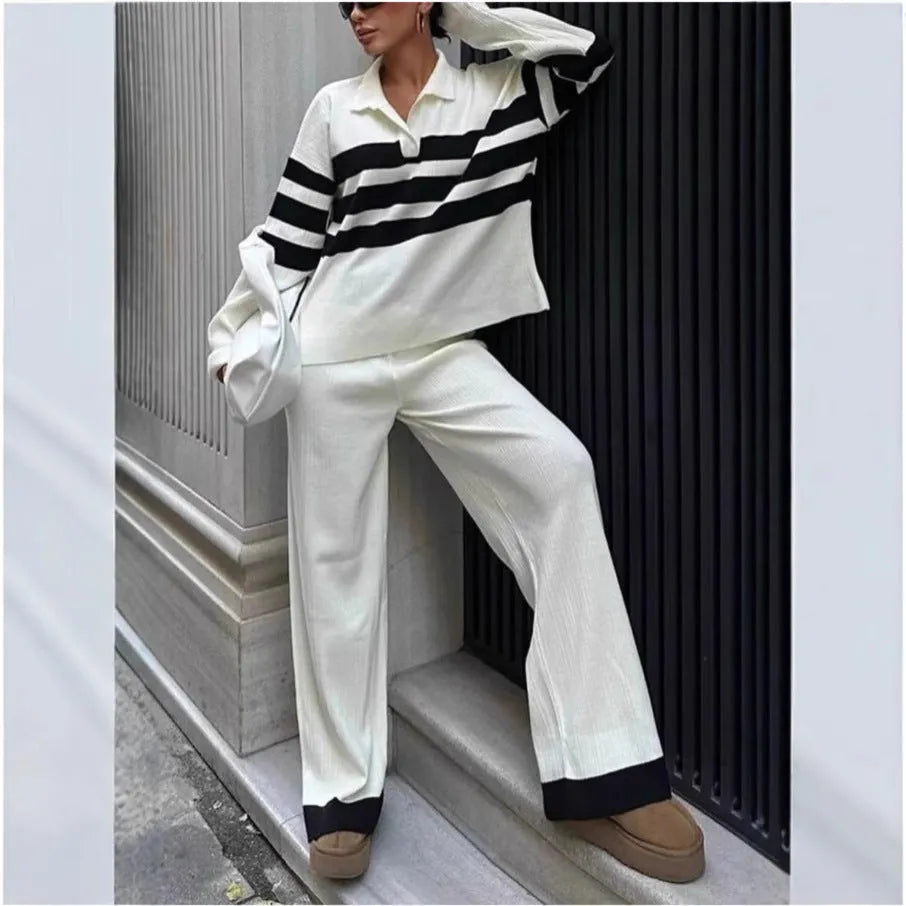 Women's black and white striped two-piece set with polo collar shirt and trousers