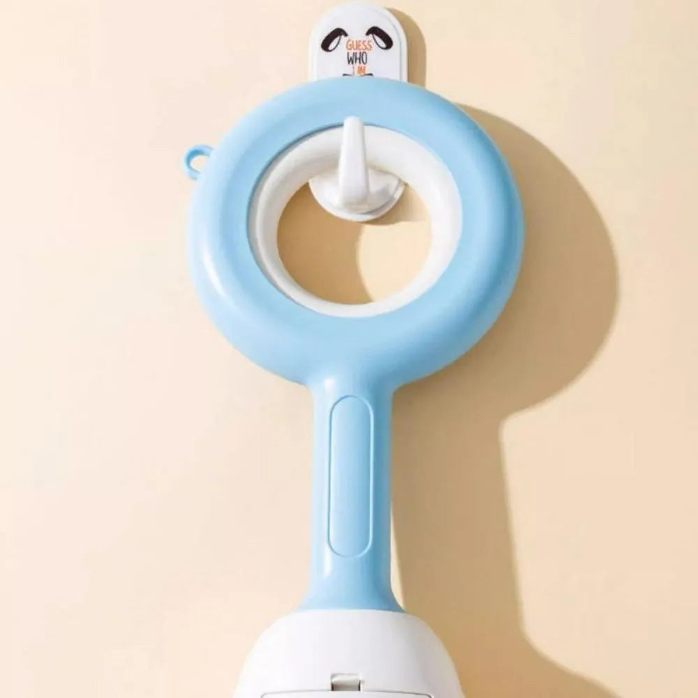 Pet dog pooper scooper with cloud shape jaw in blue colour on grass