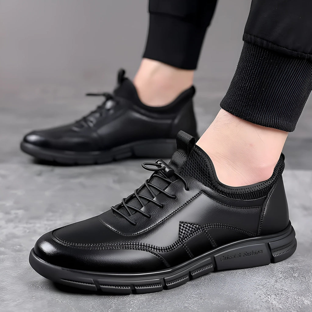 Men's black casual leather loafers with round toe, square heel, and slip-on design on a neutral background