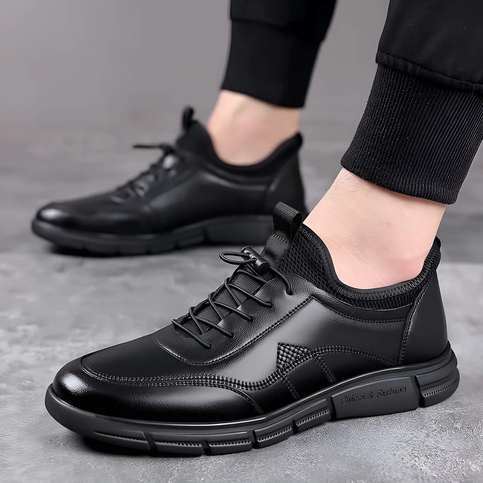 Men's black casual leather loafers with round toe, square heel, and slip-on design on a neutral background