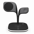 Black desktop wireless charging stand holding a mobile phone, a smartwatch, and wireless headphones.