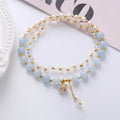 Handmade crystal double ring bracelet with natural freshwater pearl in strawberry quartz colour on wrist