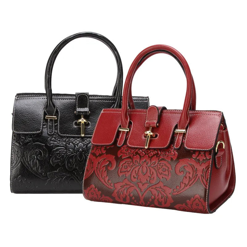 Red genuine leather women's crossbody bag with oval shape and embossed detailing.