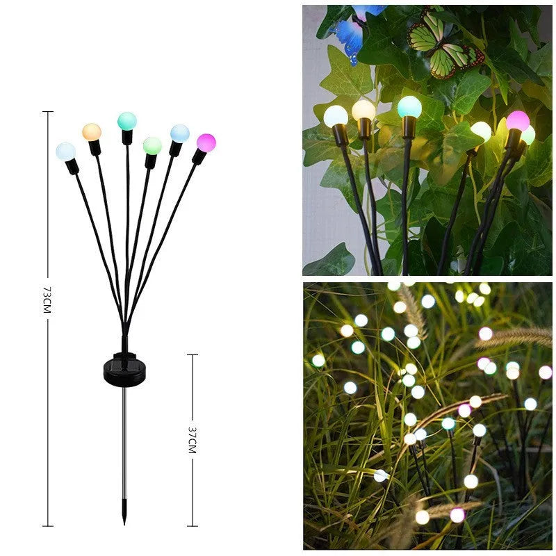 Set of solar-powered LED garden spike lights with multiple heads on stainless steel stakes for lawn or pathway.
