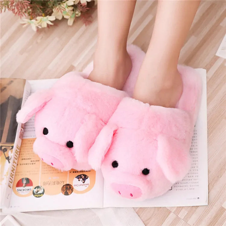 Pink pig floor slippers with soft plush exterior and cushioned interior for indoor wear