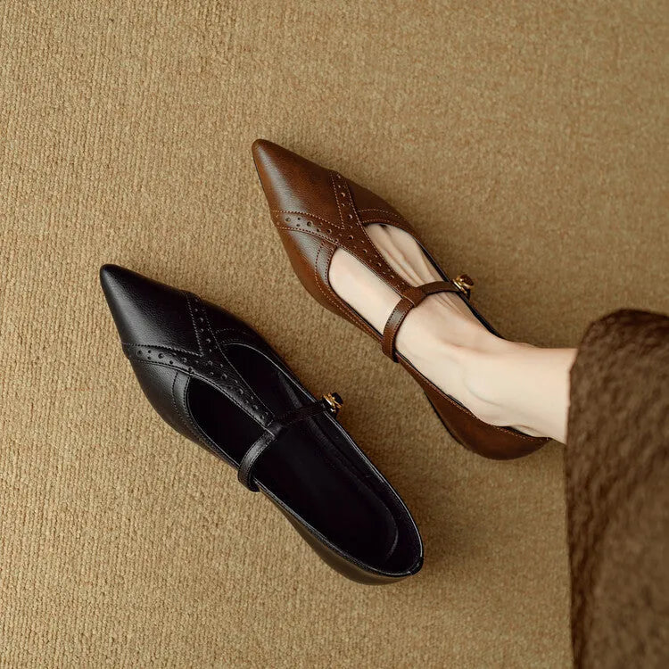 Brown leather women's low-cut flat shoes with round toe and mid heel on a white background.