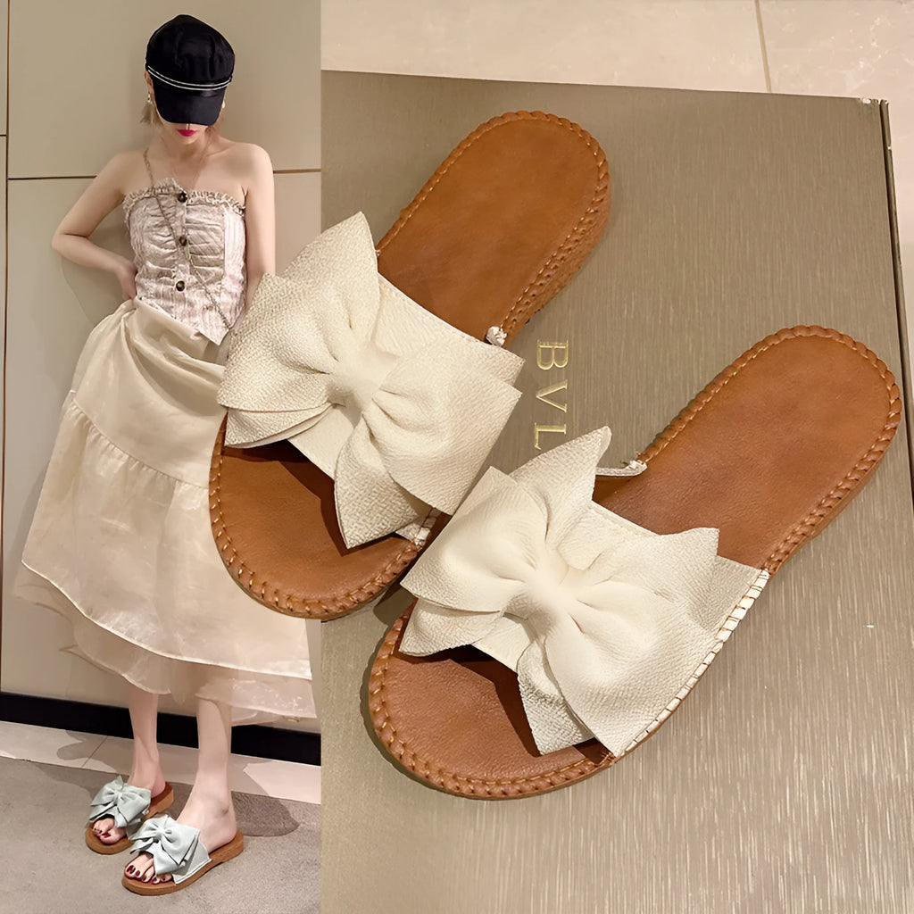 Women's slip-on suede sandals with bow detail, flat heel, rubber sole – beige colour option