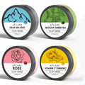 4 pack of clay face masks with Dead Sea mud, green tea, turmeric, and rose clay, each 80ml, on a white background