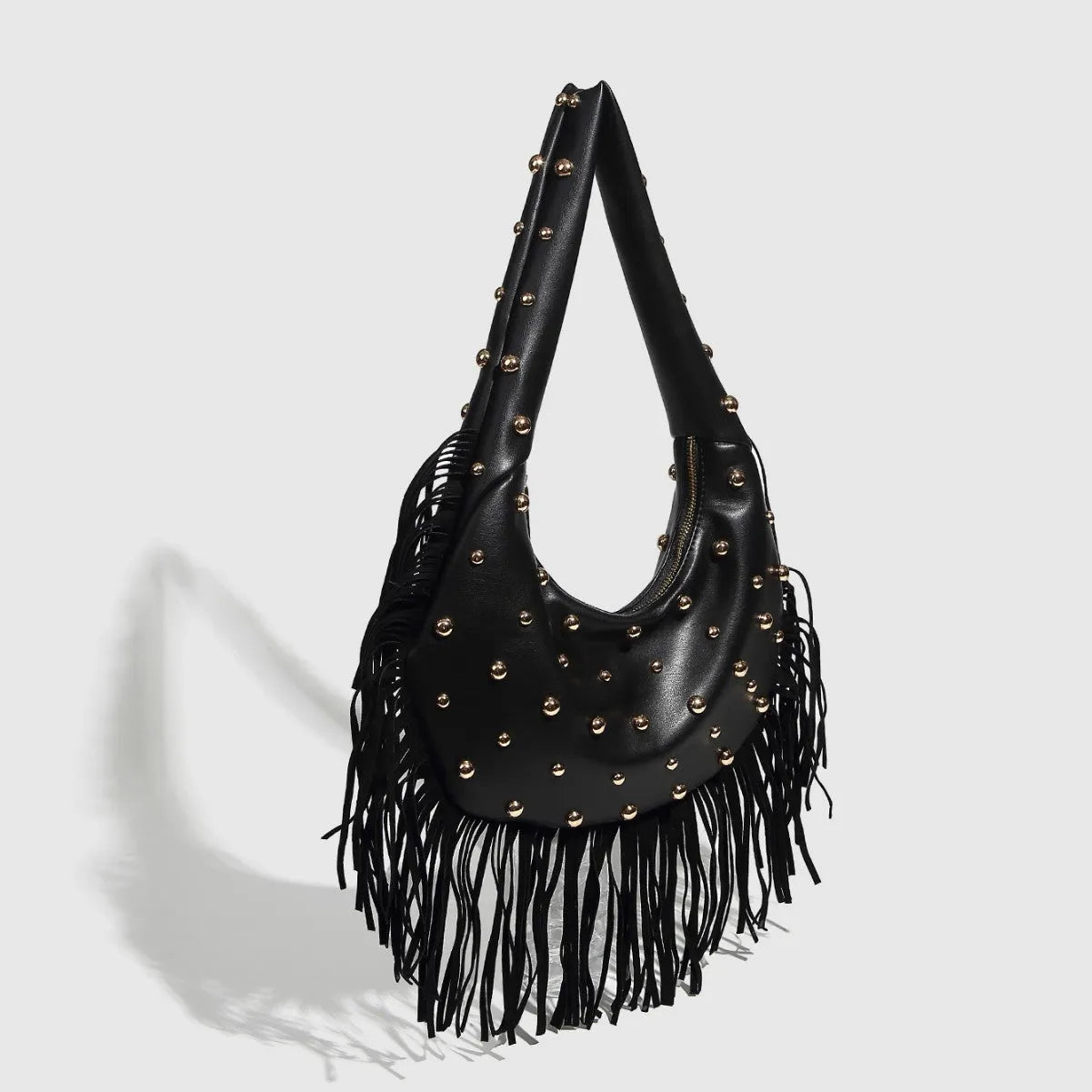 Retro tassel shoulder handbag in black with dedicated phone compartment and polyester lining