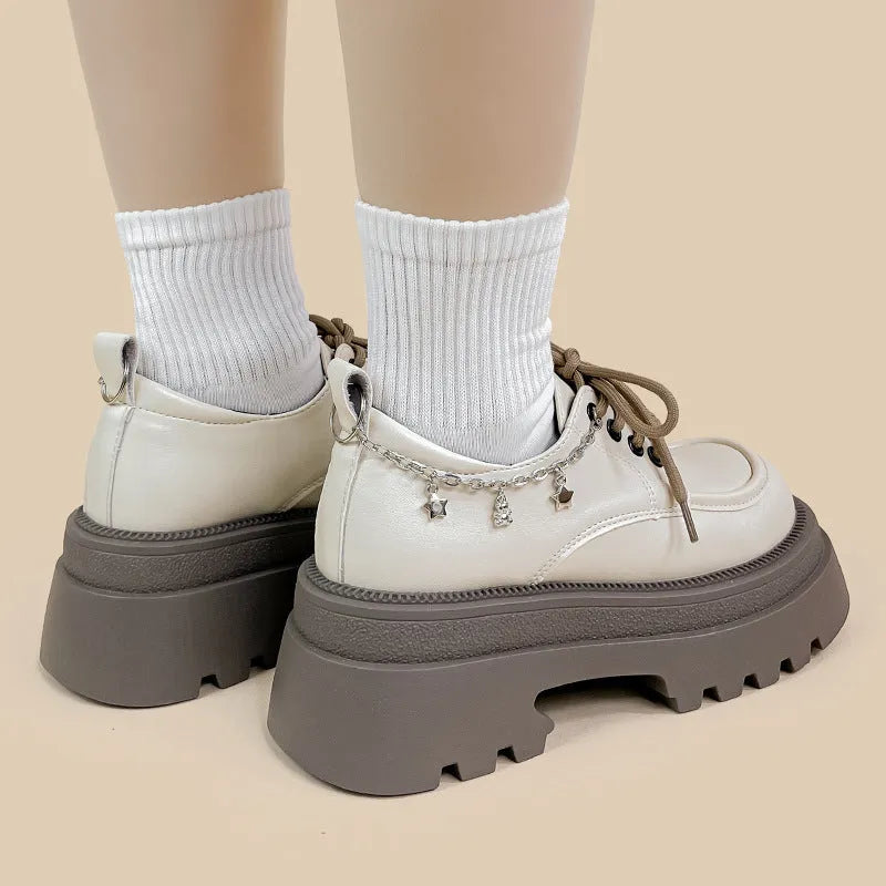 White women's platform Mary Jane shoes with chunky heel and front lace-up fastening.