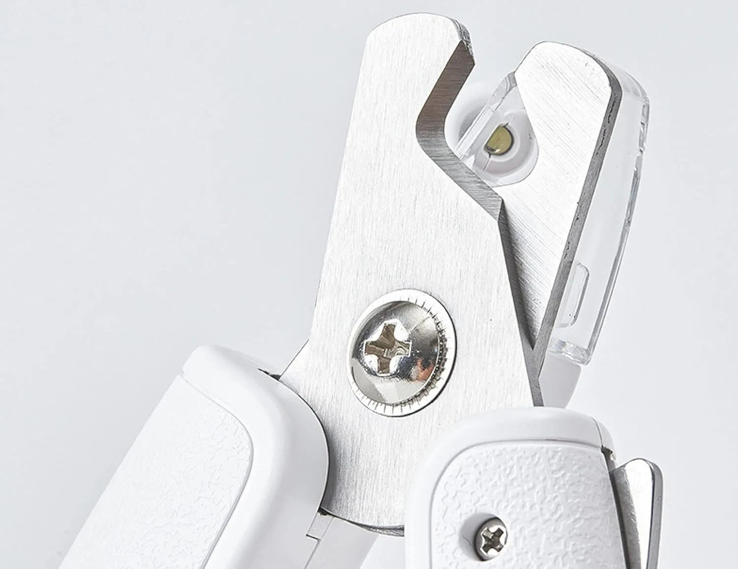 White pet nail clippers with LED light, triangular blade, and transparent anti-splash guard