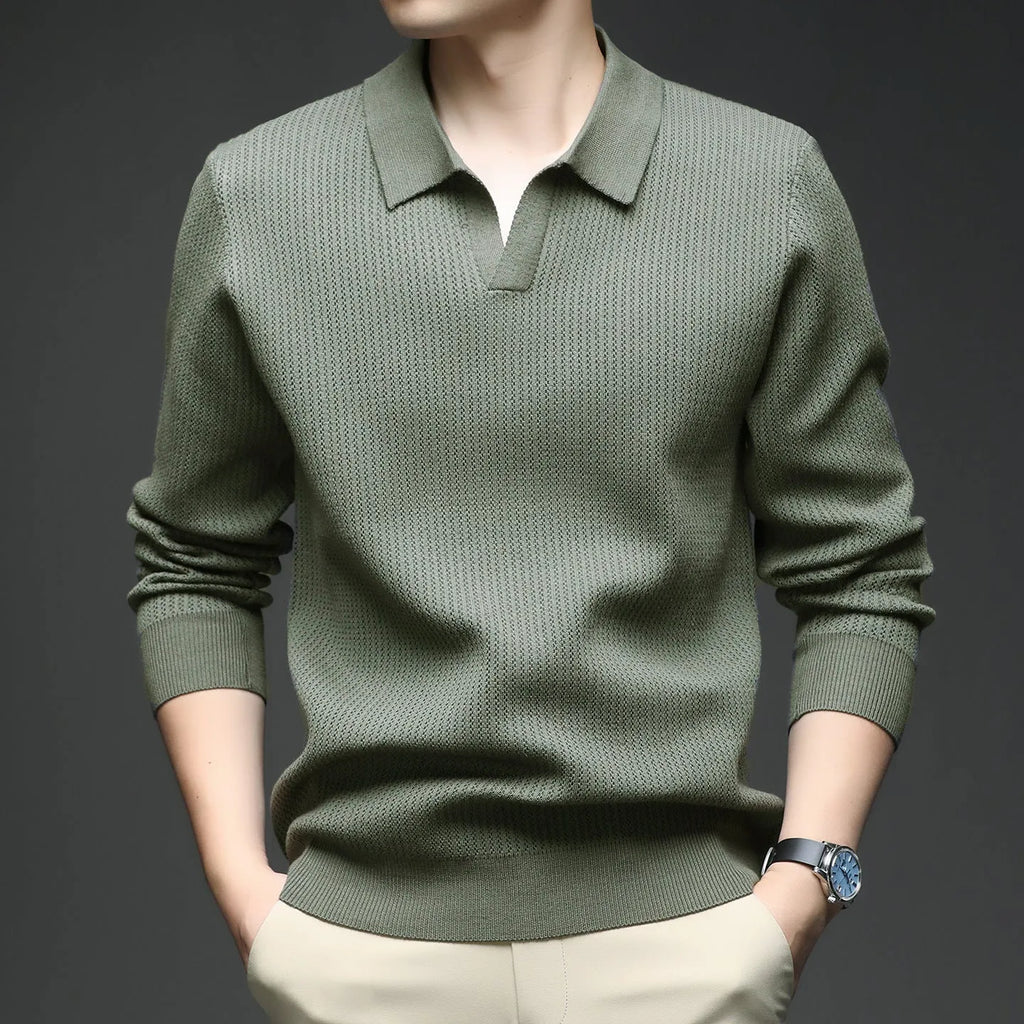 Man wearing a loose green casual pullover sweater for autumn.