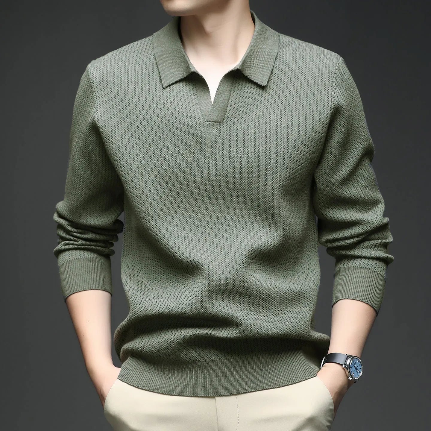Man wearing a loose green casual pullover sweater for autumn.