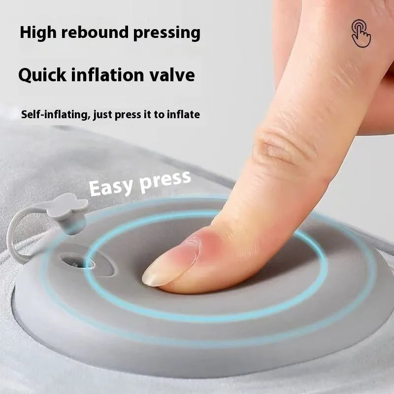 Portable press inflatable seat cushion with flocking surface folded and deflated on a table