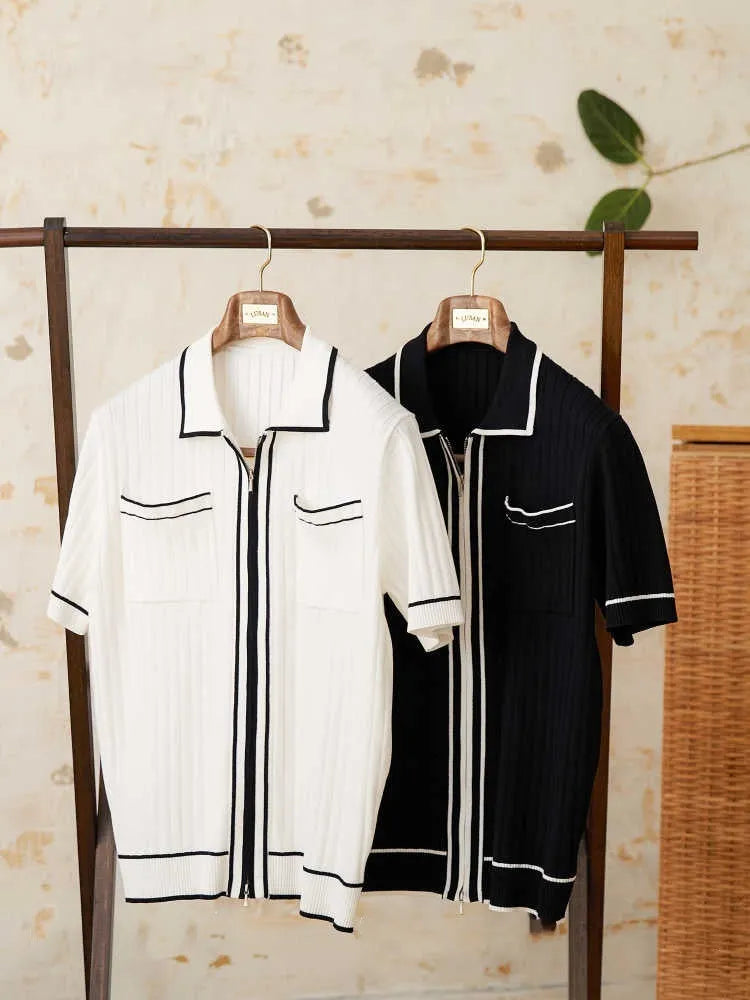 Slim fit black short-sleeved polo shirt with a lapel collar, made from a viscose and polyester knit fabric.