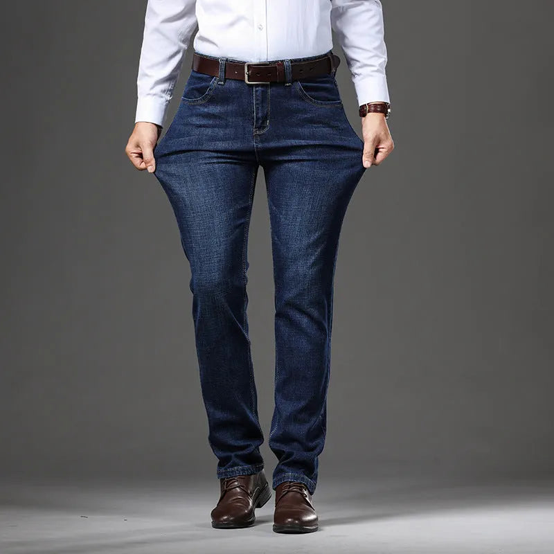 Man wearing black high-elasticity loose-fit straight-leg jeans, business casual style