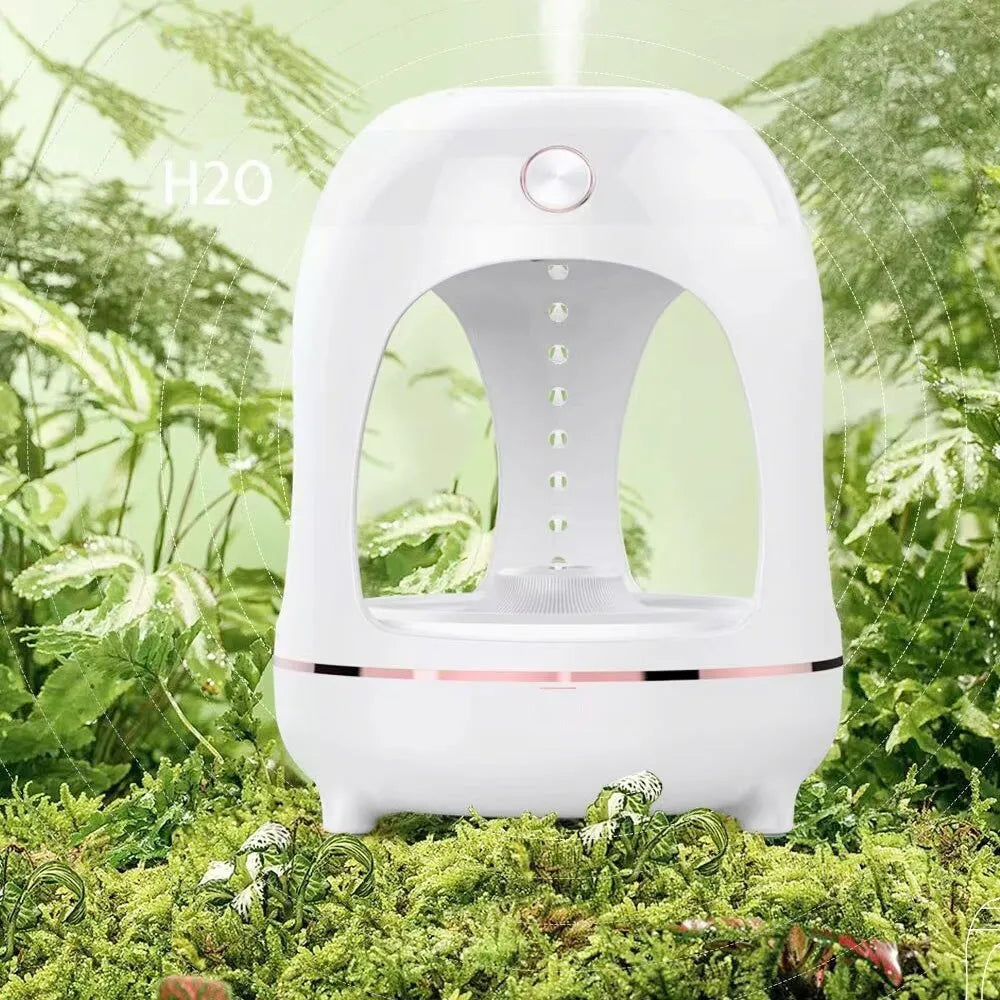 Anti gravity levitating water drops humidifier with LED night light, rose gold white, on desk