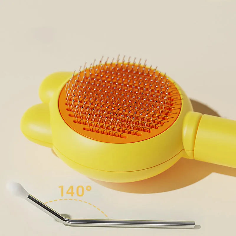 Green self-cleaning pet brush with metal comb and release button on a non-slip handle.