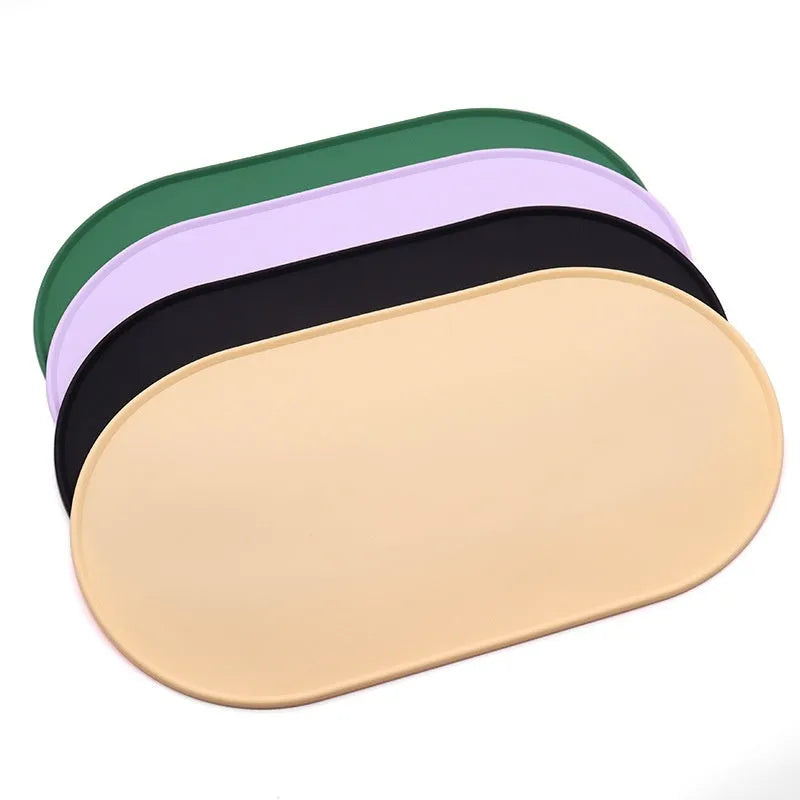 Silicone waterproof placemat for cat food and water bowls in beige, showing its size next to a bowl.