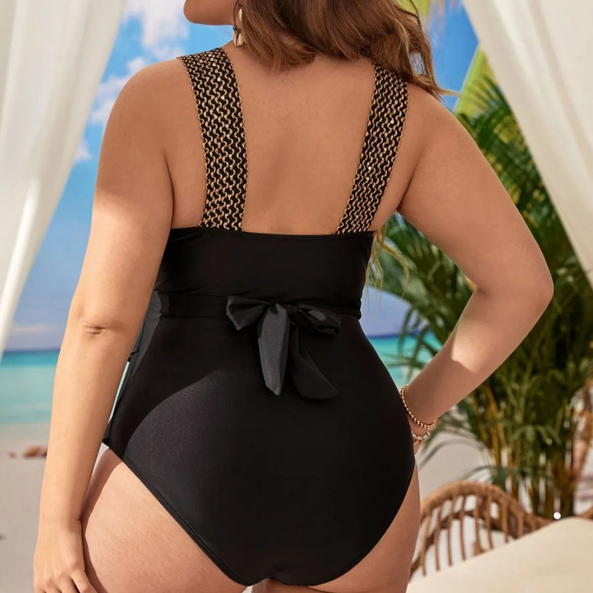 Women's black polyester one-piece swimsuit with chest pad, shown on a mannequin.