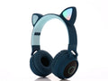 Pink wireless Bluetooth headset with large white cartoon cat ears on the headband