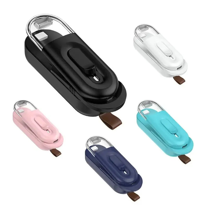 Multi-functional handheld portable battery-powered food bag sealer with sealing and cutting heads, black colour, on white background